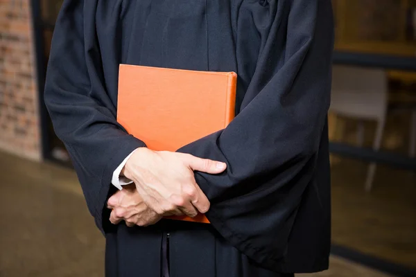 Lawyer holding a law book — Stock Photo, Image