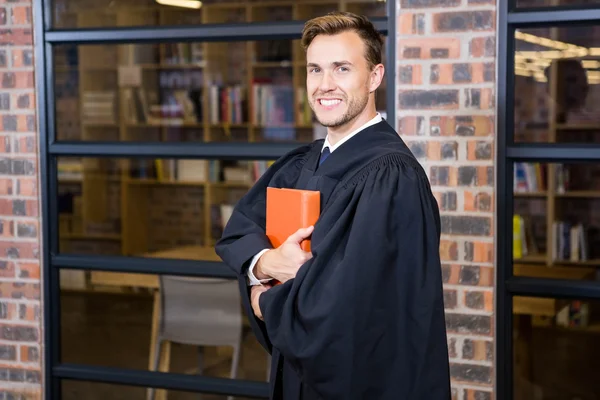 Abogado de pie con libro de leyes —  Fotos de Stock