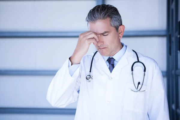 Tensed doctor standing in hospital — Stock Photo, Image