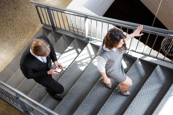 Businesspeople climbing staircase — Stock Photo, Image