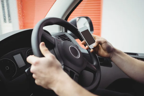 Delivery man driving his van — Stock Photo, Image