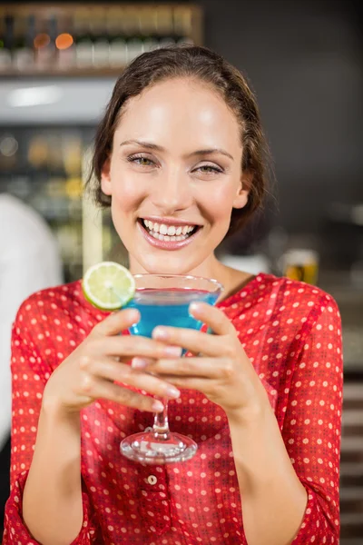 Smiling woman holding cocktail — Stock Photo, Image