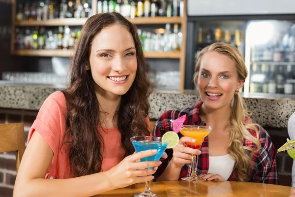 Women holding glasses of cocktails — Stock Photo, Image