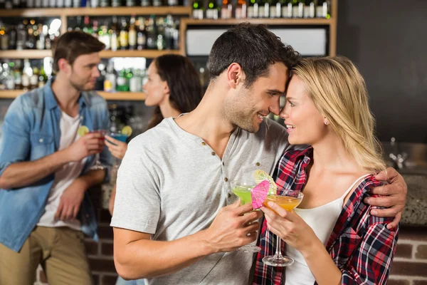 Couple toasts with cocktails — Stock Photo, Image