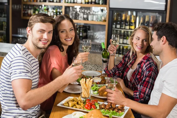 Friends toasting with white wine — Stock Photo, Image