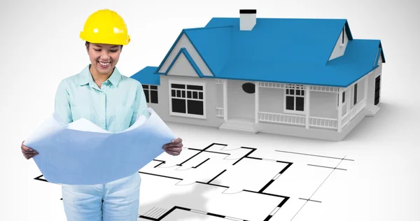 Architect reading a plan with yellow helmet — Stock Photo, Image