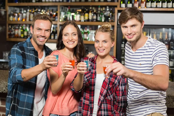 Friends toasting with shots — Stock Photo, Image