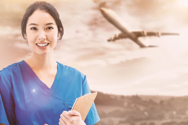 Asian nurse with stethoscope — Stock Photo, Image