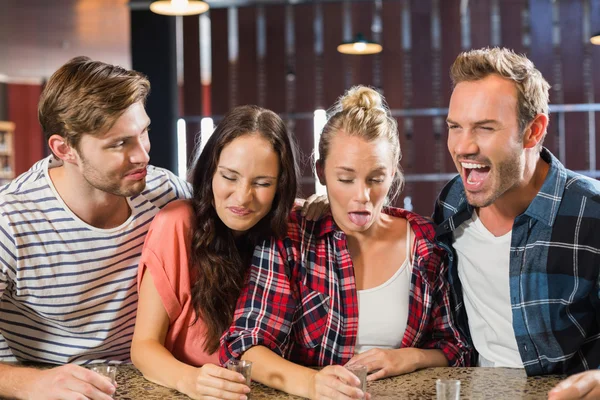 Friends making faces because of shots — Stock Photo, Image