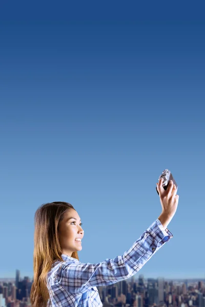Woman taking picture with camera — Stock Photo, Image