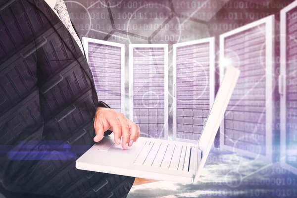 Composite image of businessman holding laptop — Stock Photo, Image