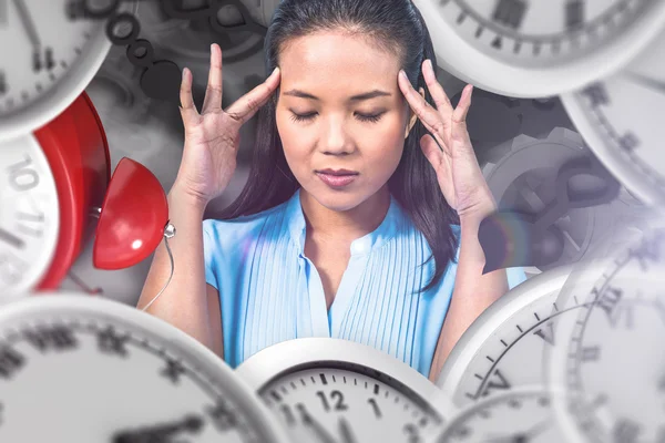 Worried businesswoman holding her head — Stock Photo, Image