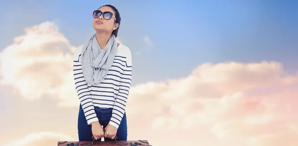 Woman with luggage against sky — Stock Photo, Image