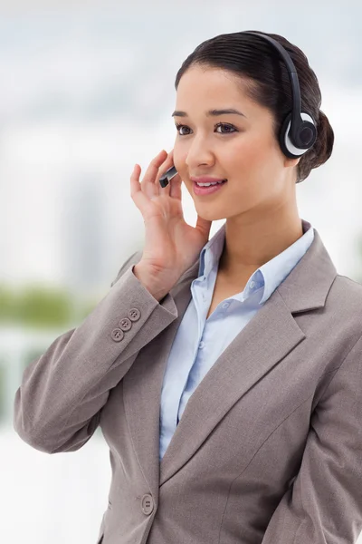 Focused operator posing with headset — Stock Photo, Image