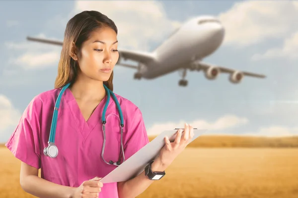 Asian nurse with stethoscope — Stock Photo, Image