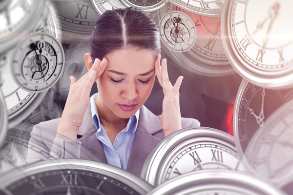 Beautiful businesswoman having headache — Stock Photo, Image