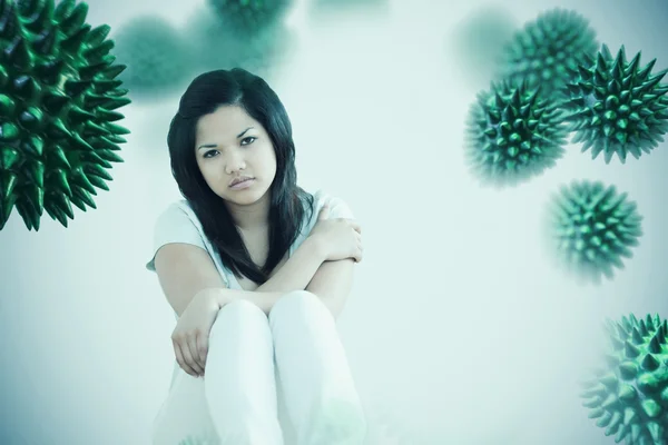 Barefoot woman sitting on the floor — Stock Photo, Image