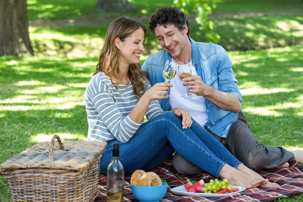 Couple having a picnic with wine — Stock Photo, Image