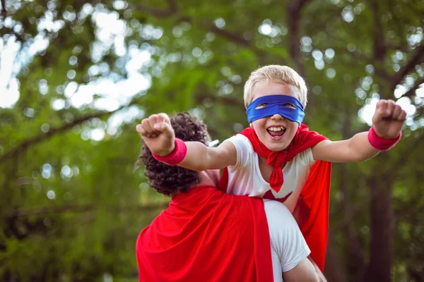 Father and son dressed as superman — Stock Photo, Image