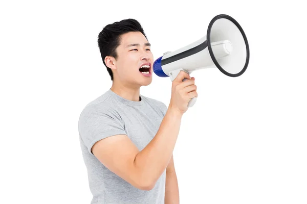 Man shouting on horn loudspeaker — Stock Photo, Image