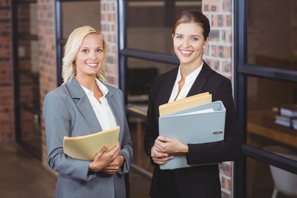 Businesswomen holding documents — Stock Photo, Image
