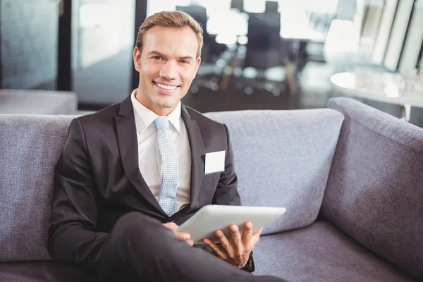 Happy businessman using digital tablet — Stock Photo, Image