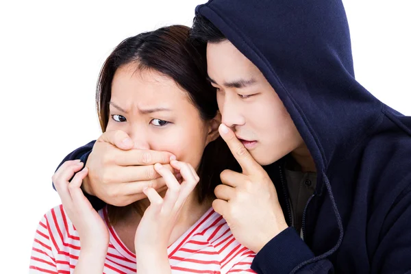 Man covering female mouth — Stock Photo, Image