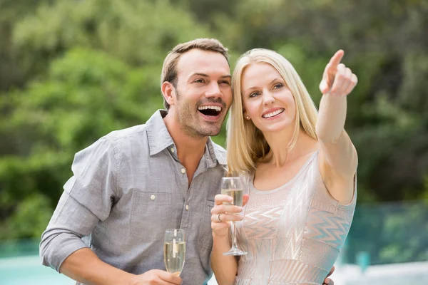 Woman pointing while standing — Stock Photo, Image