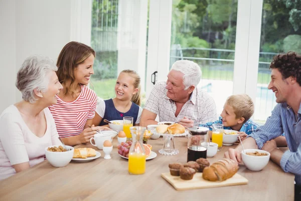 Happy family having breakfast — Stock Photo, Image