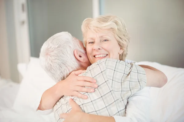 Happy senior woman hugging husband — Stock Photo, Image