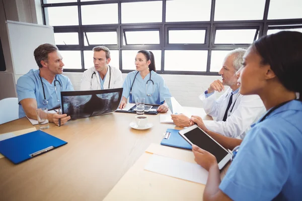 Medical team interacting in conference room — Stock Photo, Image