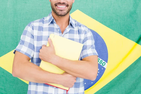 Joven sosteniendo carpeta —  Fotos de Stock