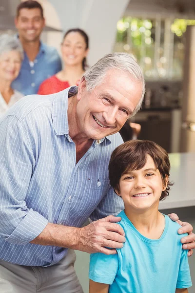 Grandfather and grandson with family — Stock Photo, Image