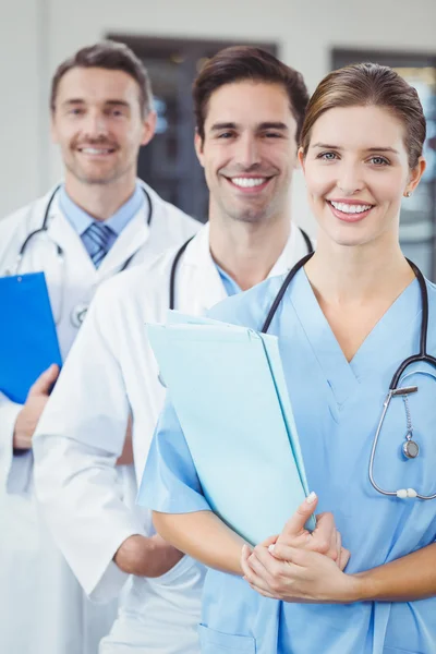 Doctors standing in row — Stock Photo, Image