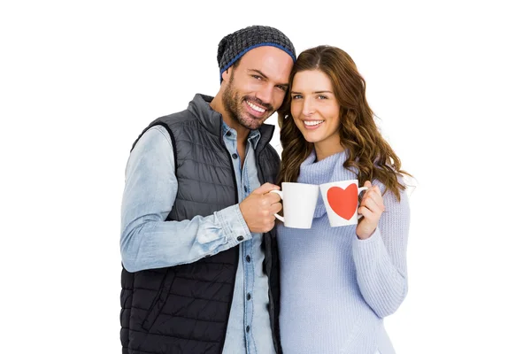 Couple holding coffee mugs — Stock Photo, Image