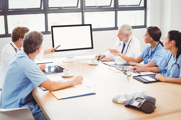 Medical team interacting in conference room — Stock Photo, Image