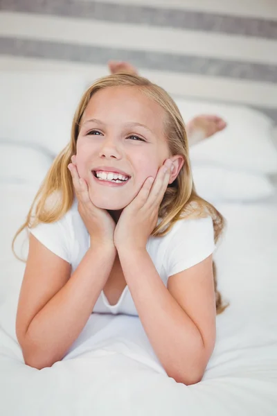Girl relaxing on bed — Stock Photo, Image