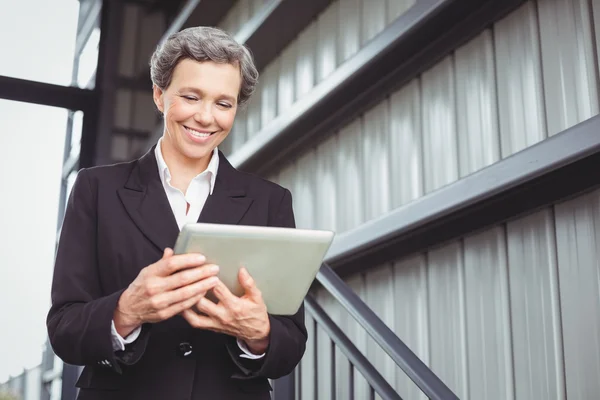 Businesswoman looking in digital tablet — Stock Photo, Image