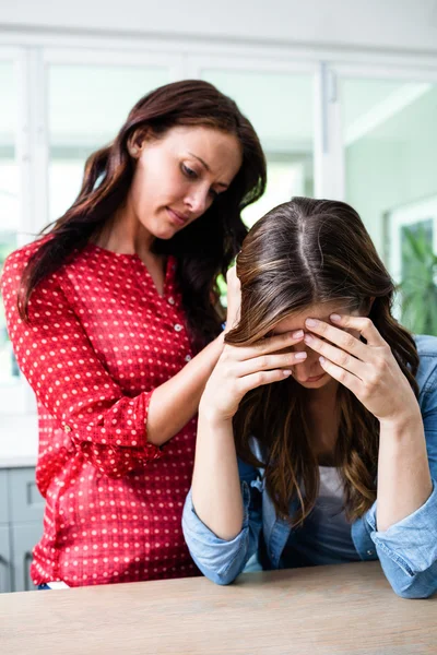 Unhappy young woman with friend — Stock Photo, Image