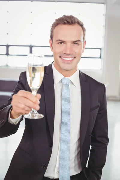 Businessman holding champagne glass — Stock Photo, Image