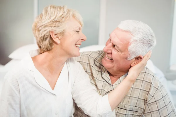 Happy senior woman romancing with husband — Stock Photo, Image