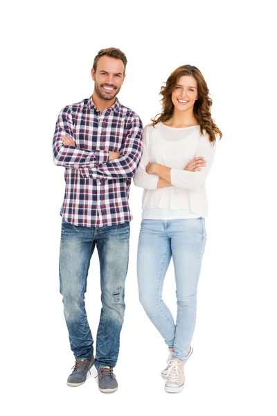 Couple standing with arms crossed — Stock Photo, Image