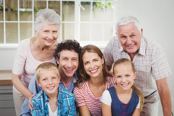Happy family against window at home Royalty Free Stock Photos