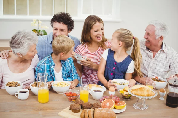 Cheerful family having breakfast — Stock Photo, Image