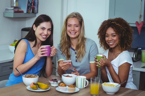 Friends having coffee at table — Stock Photo, Image