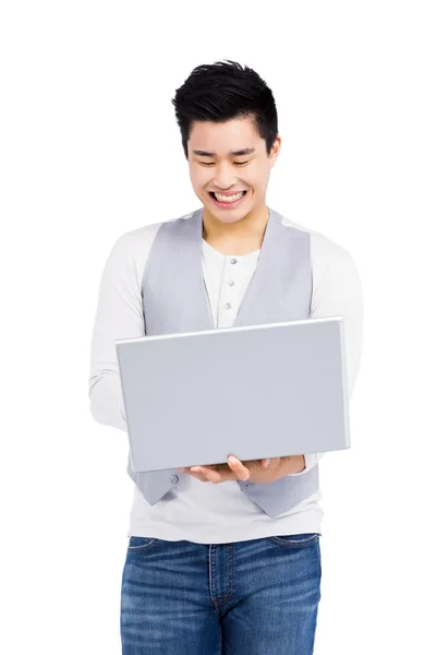 Young man using laptop — Stock Photo, Image