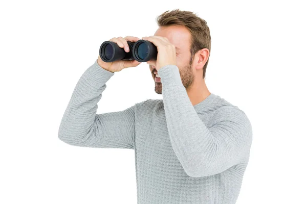 Homem olhando através binocular — Fotografia de Stock