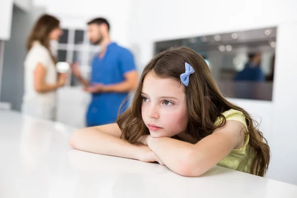 Sad girl leaning on table — Stock Photo, Image