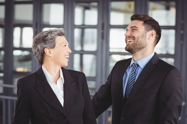 Business people laughing in office — Stock Photo, Image