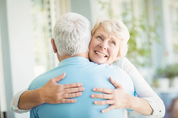 Happy senior woman hugging husband — Stock Photo, Image